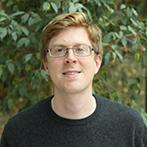 A portrait photograph of Simon Badger